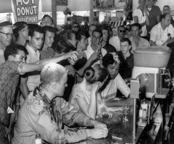 FILE-This is a May 28, 1963, file photograph of a sit-in demonstration at a Woolworth's lunch counter in Jackson, Miss., where whites poured sugar, ketchup and mustard over heads of the demonstrators. Seated at the counter, from left, are John Salter, Joan Trumpauer and Anne Moody. Moody, whose memoir Coming of Age in Mississippi gave a wrenching account of growing up poor in the segregated South and facing violence as a civil rights activist, died Thursday, Feb. 5, 2015, at her home in the small town Gloster, Mississippi. She was 74. (AP Photo/Jackson Daily News, Fred Blackwell, File)